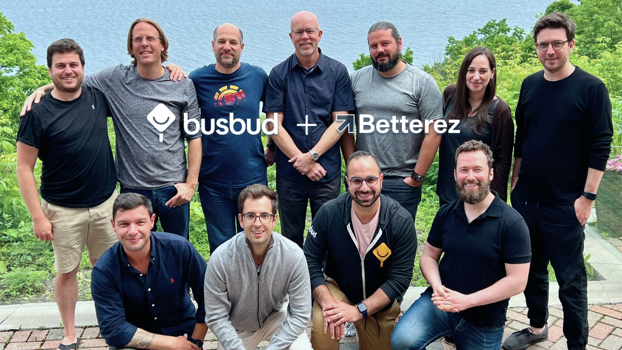 Members of the Busbud and Betterez teams posing together outdoors to mark the two companies joining forces